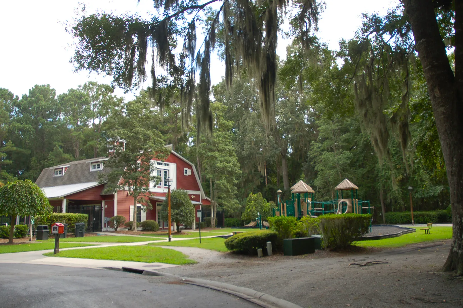 Community pool, barn-style clubhouse and playground at The Farm at Buckwalter in Bluffton SC