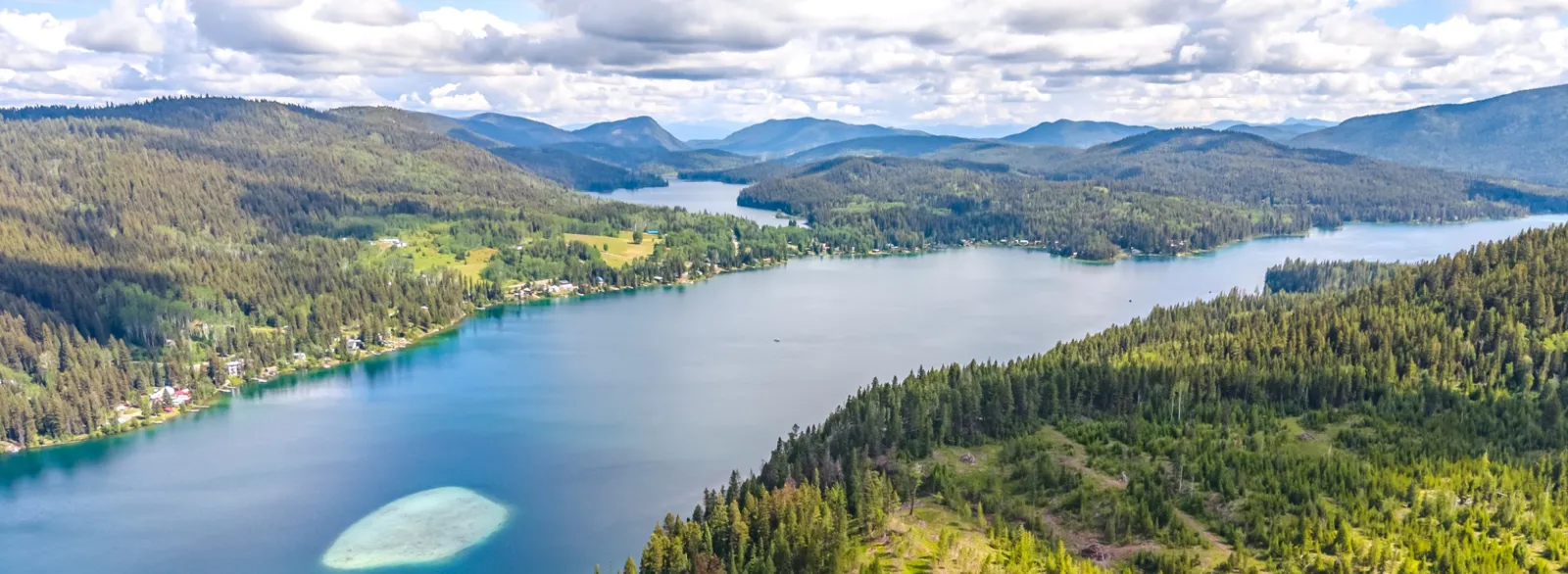 Aerial view across Sulphurous Lake, its wooded shoreline and surrounding hills