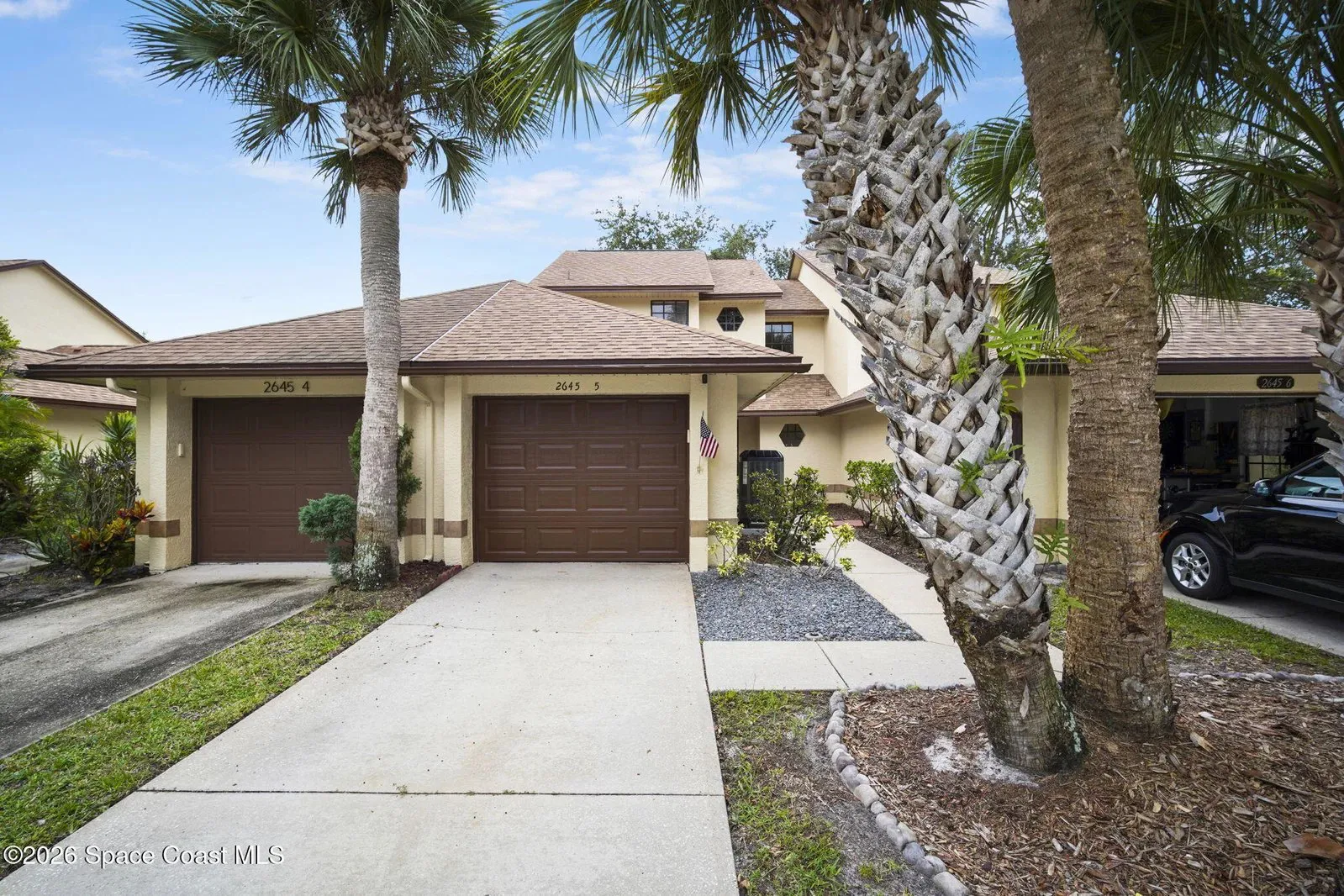 Front exterior and garage of 2645 Elliot Way #5, Weston Park townhome in Melbourne FL