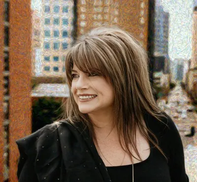 Kelly M. DeCarlucci, REALTOR, portrait with the Tampa skyline