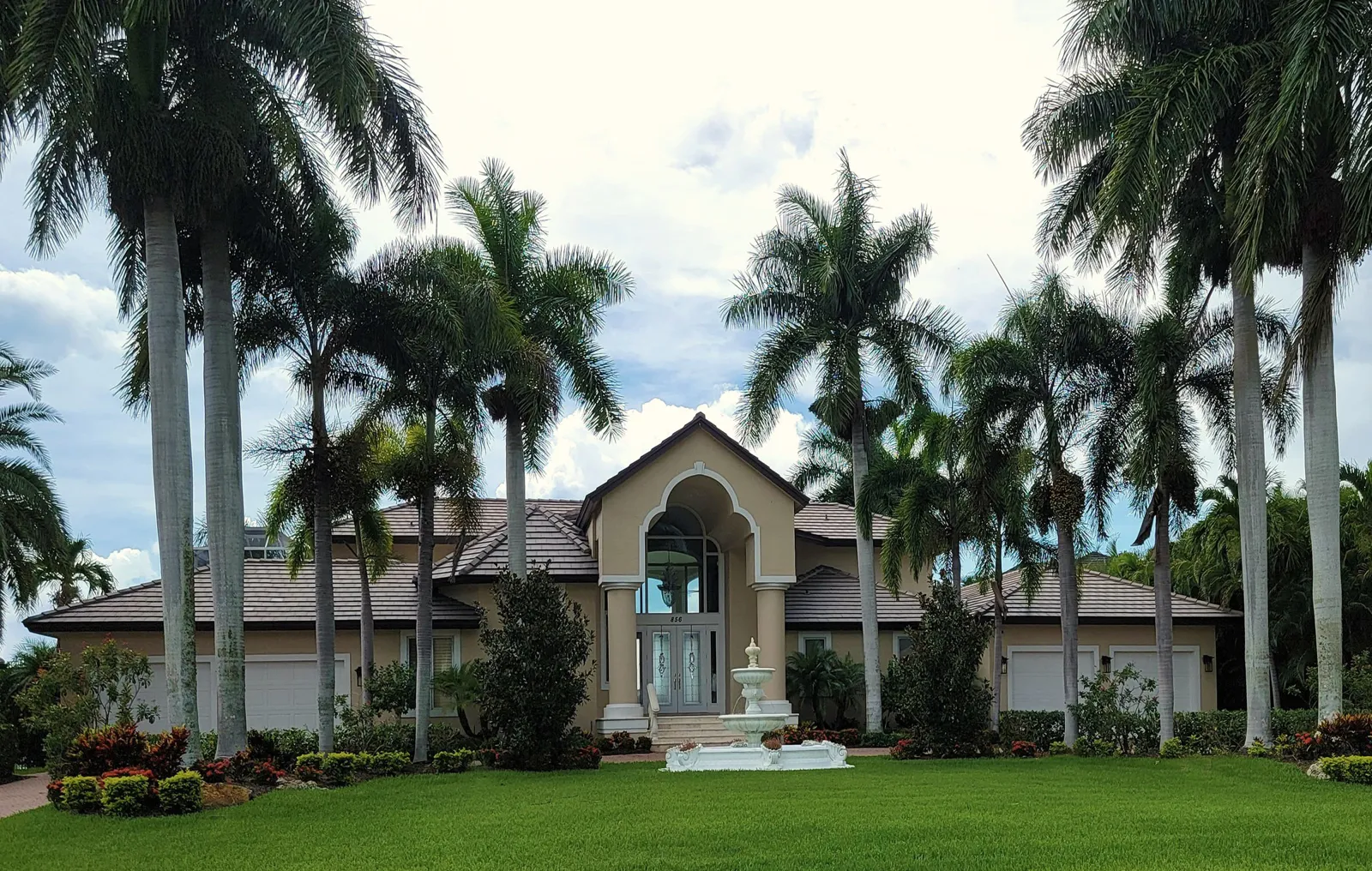 Palm-lined entrance to a private residential community
