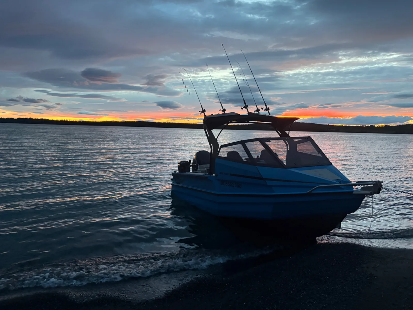 A fishing boat on Green Lake at sunset