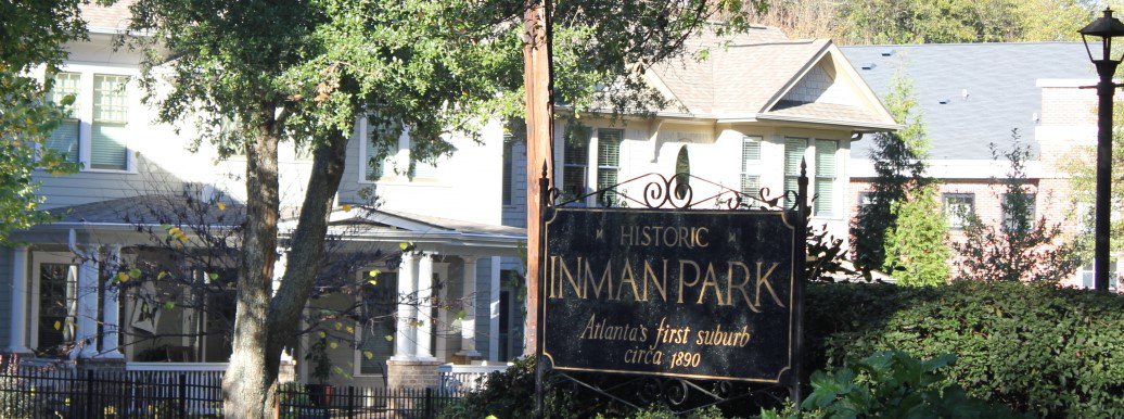Picture of welcome to Inman Park sign in front of typical Inman Park Real Estate