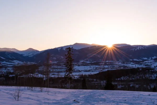 Sunset overlooking vacant land for sale in Summit County Colorado