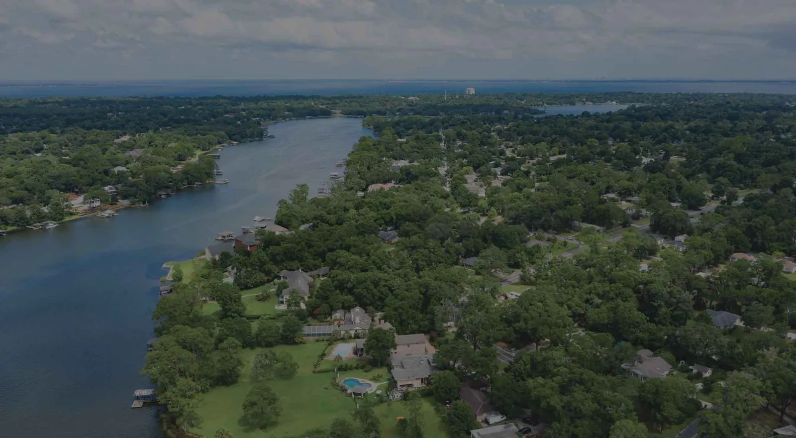 drone view of real estate along Bayou Texar in East Hill