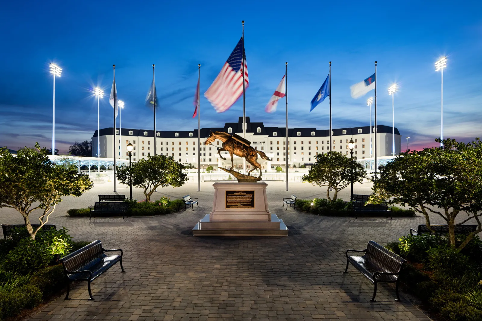 World Equestrian Center Ocala, Florida - Equestrian Hotel, horse statue and flags at dusk