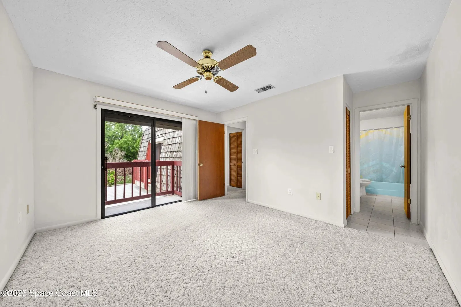 Upstairs bedroom with balcony door and private bath, 44 Piney Branch Way