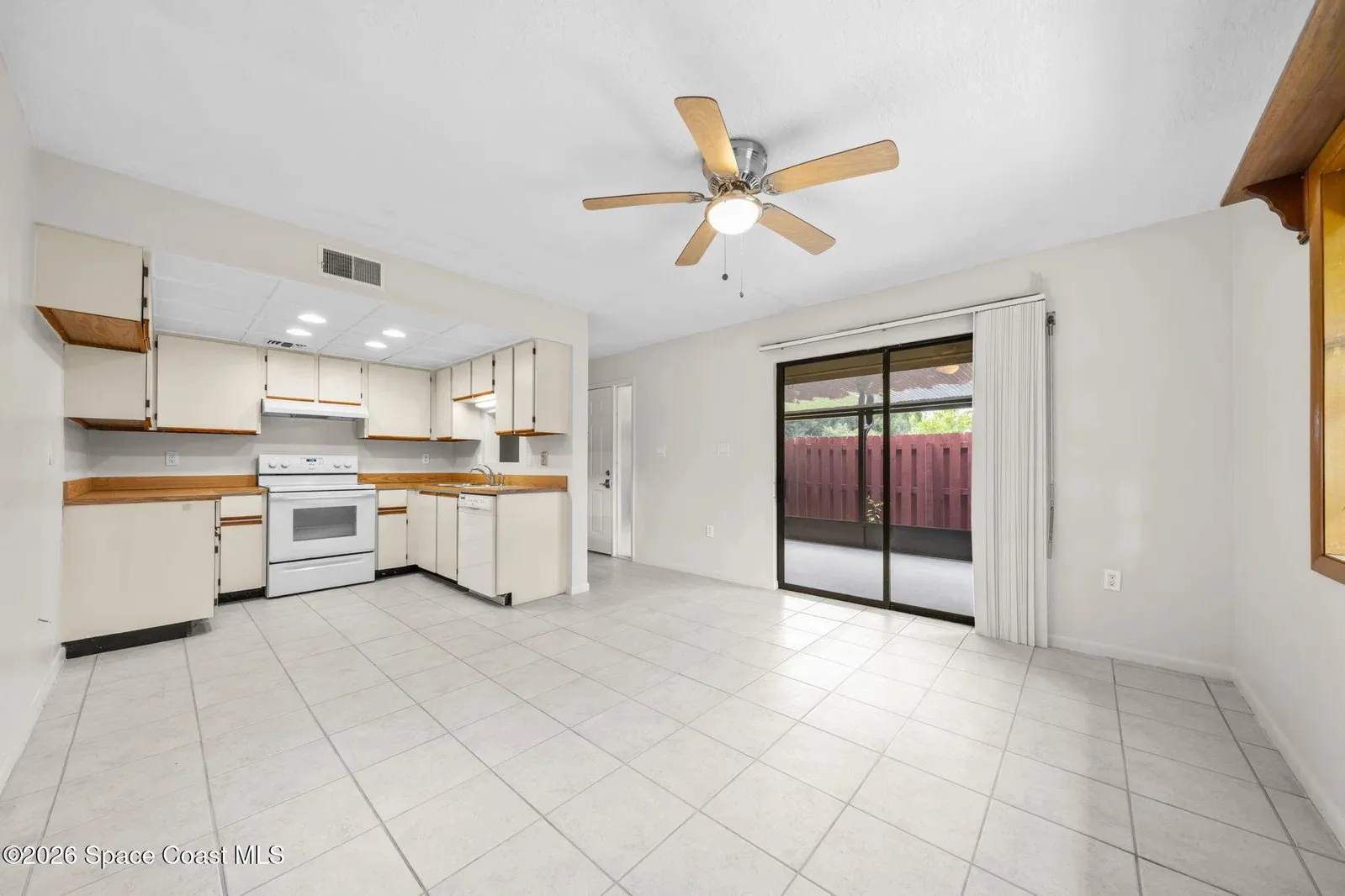 Living area and kitchen at 44 Piney Branch Way, Melbourne FL