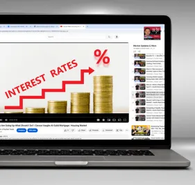 A computer screen showing the Robert J Fischer Team interest rate videos on YouTube and how they are an interest rate resource for the community.