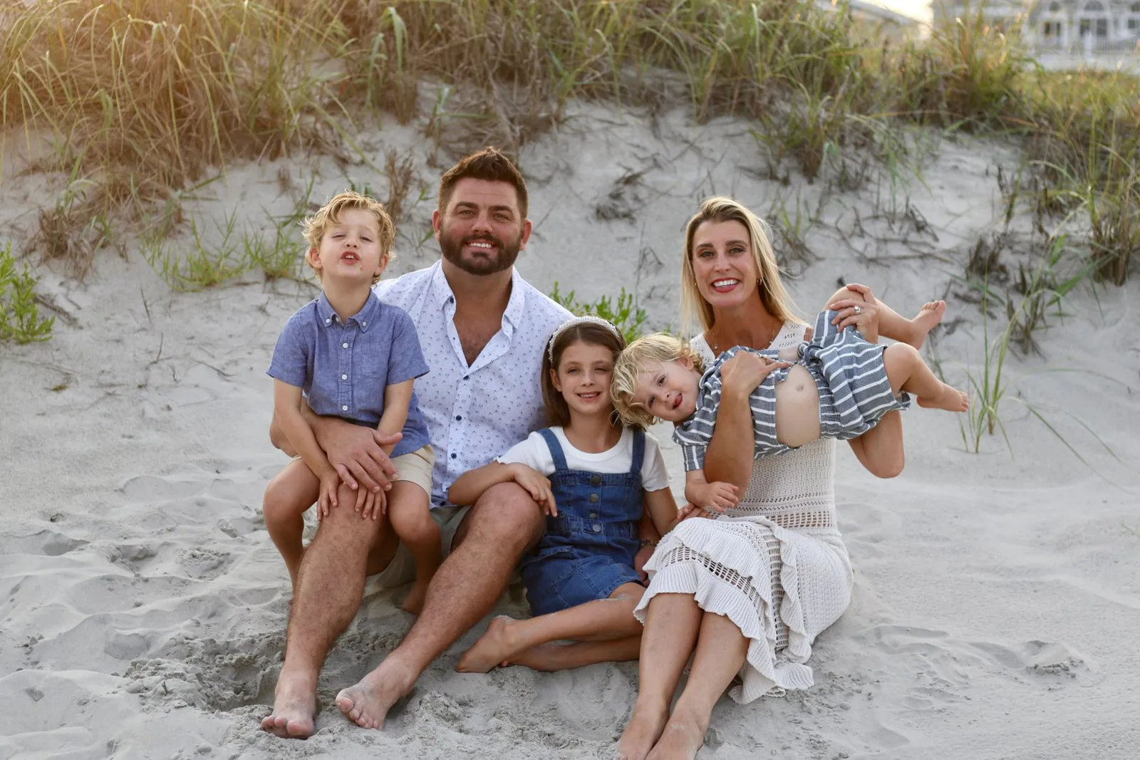 Graham and Alicia Ginn with their three children on the beach in Ocean City, NJ