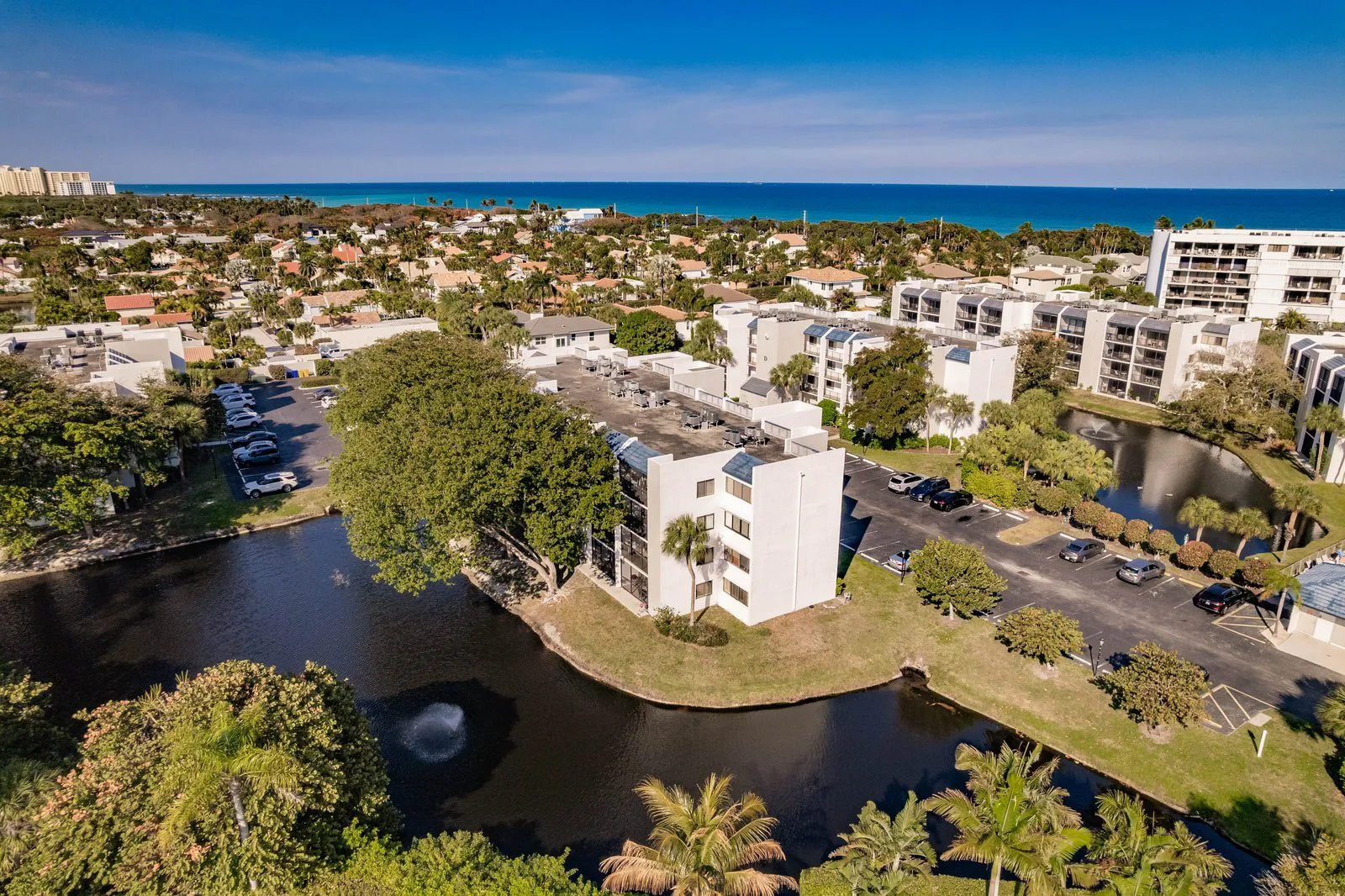Condominiums beside a pond in Jupiter, from above