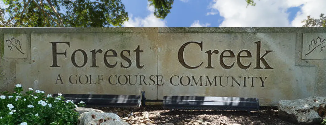 Forest Creek Neighborhood in Round Rock, TX Entrance Sign saying "Forest Creek a Golf Course Community"